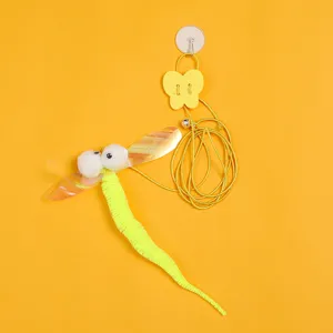 Close-up detail of hanging cat teaser toy with elastic rope and fuzzy bug design.