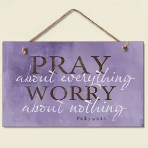 Detailed view of purple wooden hanging sign with inspirational quote and rustic rope hanger.
