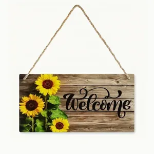 Wooden hanging sign detail showing sunflower pattern and welcome text for rustic home decor.