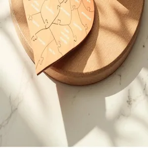 Wooden heart puzzle detail shot, touching Father's Day gift with engraved words and natural textures.