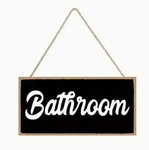 Rustic wooden bathroom hanging sign with rope, black and white wall decor detail view.