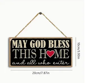 Wooden hanging sign detail showing textured black surface with white blessing typography.
