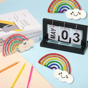 Close-up detail of unfinished wooden rainbow cloud DIY craft ornament for creative handmade projects.