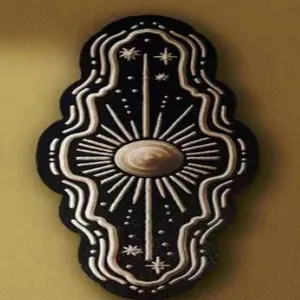 Wooden celestial wall hanging decor with sun and star motifs for mystical home decoration.