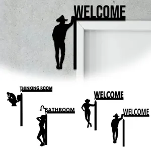 Close-up details of black wooden silhouette door corner decor, funny home wall hanging design.