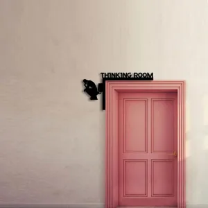 Black wooden thinking room door corner sign, funny bathroom toilet wall hanging decor detail.