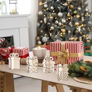Detailed view of wooden 3d gift box ornaments for christmas holiday table decor setup.