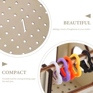 Close-up detail view of wooden pegboard and colorful heart-shaped knitting stitch markers.