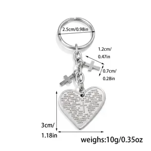 Stainless steel heart cross keychain detail view showing dimensions and engraved text.