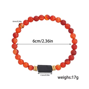 Red agate beaded bracelet with black stone centerpiece and gold spacers, detailed size view.