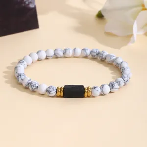 White Howlite Beaded Bracelet with Black Center Stone and Gold Spacers Fashion Detail