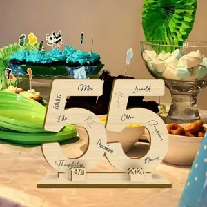 Wooden number 55 sign detail showing personalized laser engraved names and memorial years.