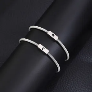 Stainless steel spring couple bracelets set featuring sun and moon charms for lovers jewelry.