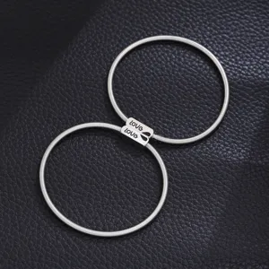 Stainless steel spring couple bracelets set, silver tone matching love engraved detail jewelry gift.