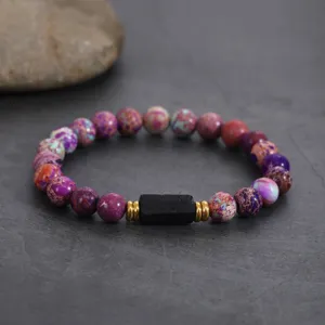 Multicolored imperial jasper and black obsidian beaded bracelet with gold spacers for daily wear.