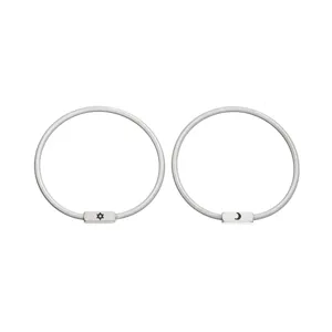 Close-up view of stainless steel sun and moon couple bracelets detail design showcase.