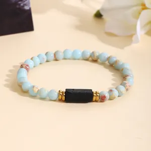 Chic gemstone beaded bracelet with metal spacers and central black stone for women daily wear.