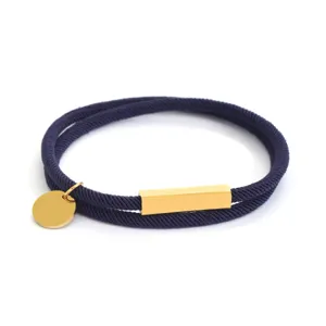 Bracciale in corda Milan in acciaio inossidabile con barra dorata e ciondolo rotondo elegante.