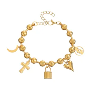 Gouden RVS bedelarmband detail, kruis hart slot hangers, vintage stijl dames sieraden
