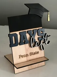 Wooden graduation countdown sign detail showing DAYS left and Penn State lettering.