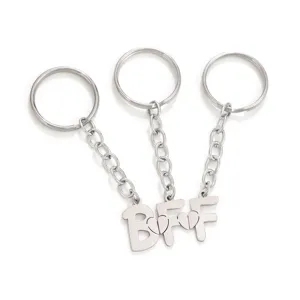 Stainless steel BFF friendship keychain detail shot, matching heart puzzle design accessory.
