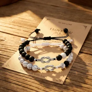 Couple natural stone beaded bracelet with metal love knot design, matching black and white.