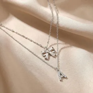 Collana multistrato in argento con fiocco e pendente con lettere in strass gioielli da donna