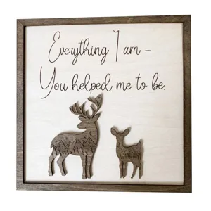 Wooden deer decorative wall art detail, rustic laser cut mother and child elk design with inspiring quote.