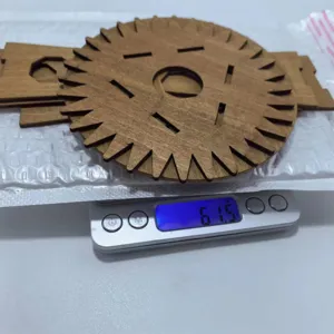 Wooden gear disc detail shot, precise craftsmanship, handmade weaving tool component, natural wood.