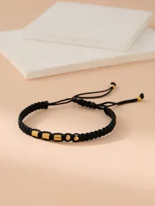 Discover this stylish black braided Morse code bracelet featuring sleek gold metal beads.