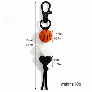 Detailed view of the sports themed basketball keychain with silicone beads and black tassel.