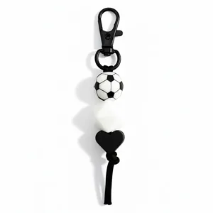 Sports style football keychain with black metal clasp and silicone beads for bags or keys.