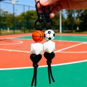 Sporty basketball and football keychain, stylish silicone beads and black tassel bag charm.