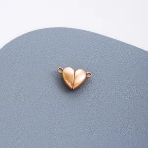 Gold heart magnetic clasp charm for DIY jewelry making, durable stainless steel component.