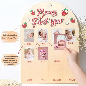 Panneau photo jalonnant la première année de bébé en bois pour fête d'anniversaire.