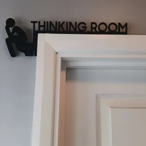 Black metal thinking room door topper sign, creative silhouette iron wall art decor detail.