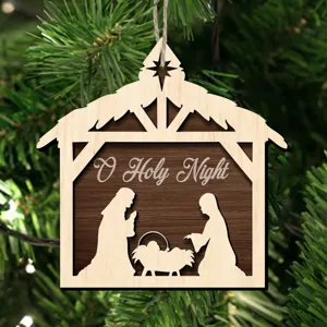 Wooden Nativity scene Christmas hanging ornament detail, rustic holiday tree decoration.