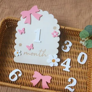 Wooden baby milestone monthly plaque photography prop set with numbers and bows for newborn record.