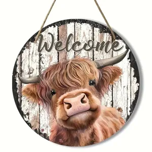 Rustic round wooden hanging sign featuring a cute Highland cow and Welcome text for home decor.