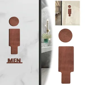Wooden toilet sign detail shot, showing the dark brown wooden texture and finish.
