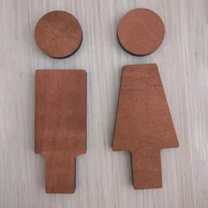 Wooden restroom sign set, minimalist male and female toilet wall decor detail closeup.
