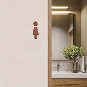 Wooden female toilet sign detail, minimalist bathroom wall decor, modern restroom sign craft.