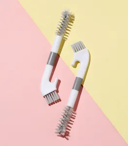 Detailed view of the multi-functional cup lid crevice cleaning brush, showing bristles and hook.