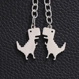 Stainless steel dinosaur keychain detail view, cute animal pendant with metal chain accessory.