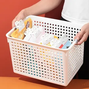 White plastic storage basket with handles, mesh design for desktop, kitchen and toy organization.