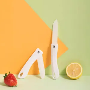 Coltello da frutta in ceramica pieghevole portatile giapponese con manico bianco per cucina.