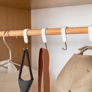 Stainless steel S-shaped hook with anti-slip buckle hanging on wooden wardrobe rod.