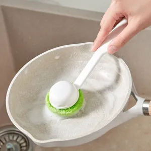 Long handle cleaning brush with green sponge head for washing pots and kitchen pans.