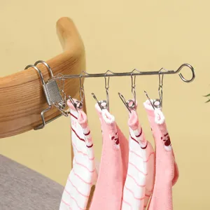 Portable stainless steel multi-clip clothes hanger for travel home sock drying rack.