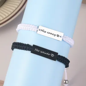 Stainless steel couple braided bracelet set with black and white matching engraved tags.